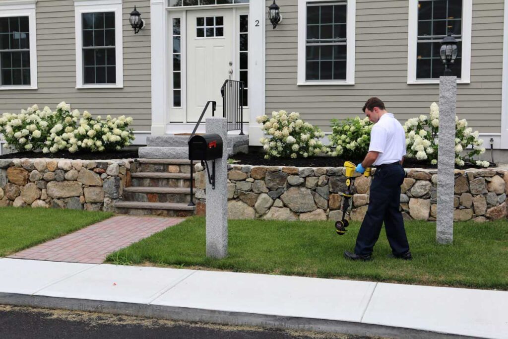 Technician checking a sewer line from outside a home