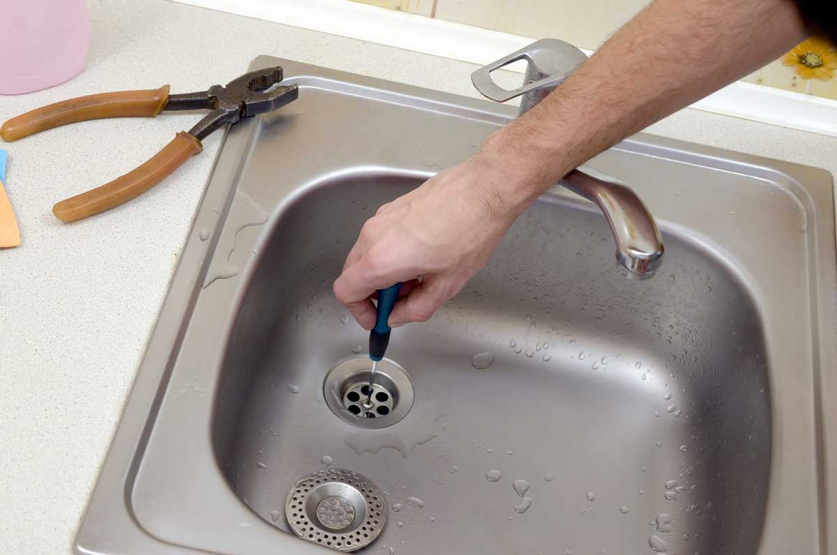 unclogging kitchen sink