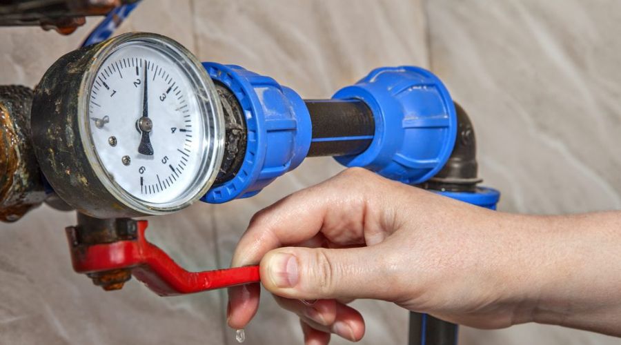 Spencer HVAC tech installing heating system